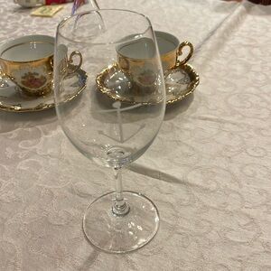 One Riedel glass 7 3/8” tall, 2 1/4” width,signed